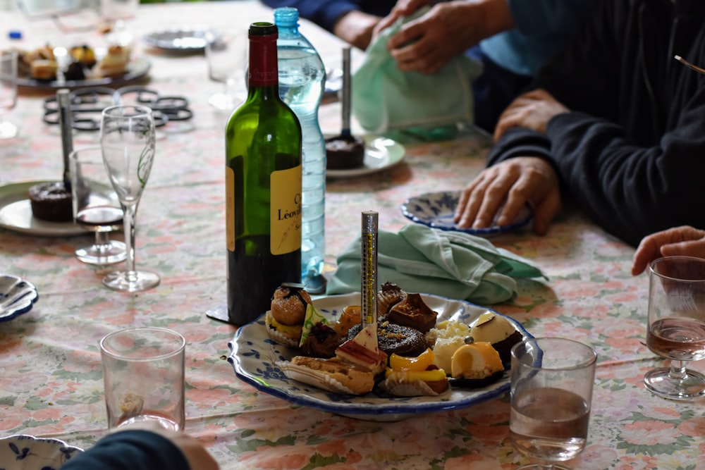 green glass bottle on table