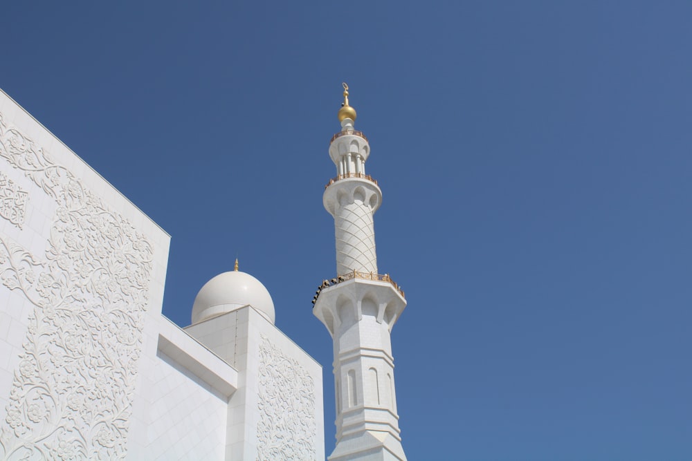 white concrete tower under blue sky during daytime