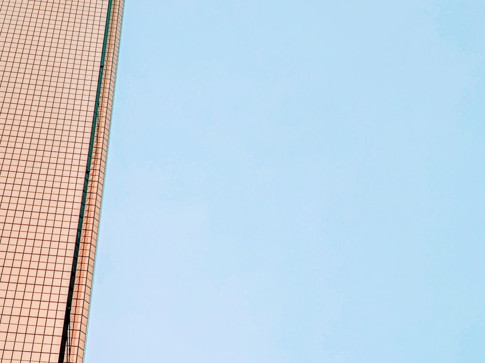 brown and white concrete building under blue sky during daytime