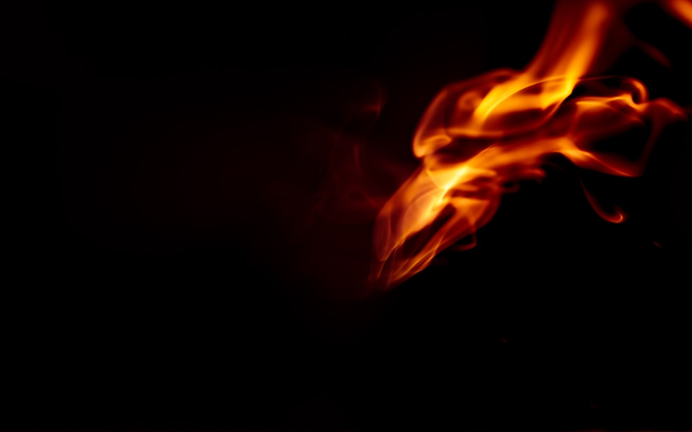 red and yellow fire in dark room