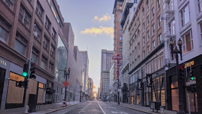 Wide shot of commercial storefronts in urban area.