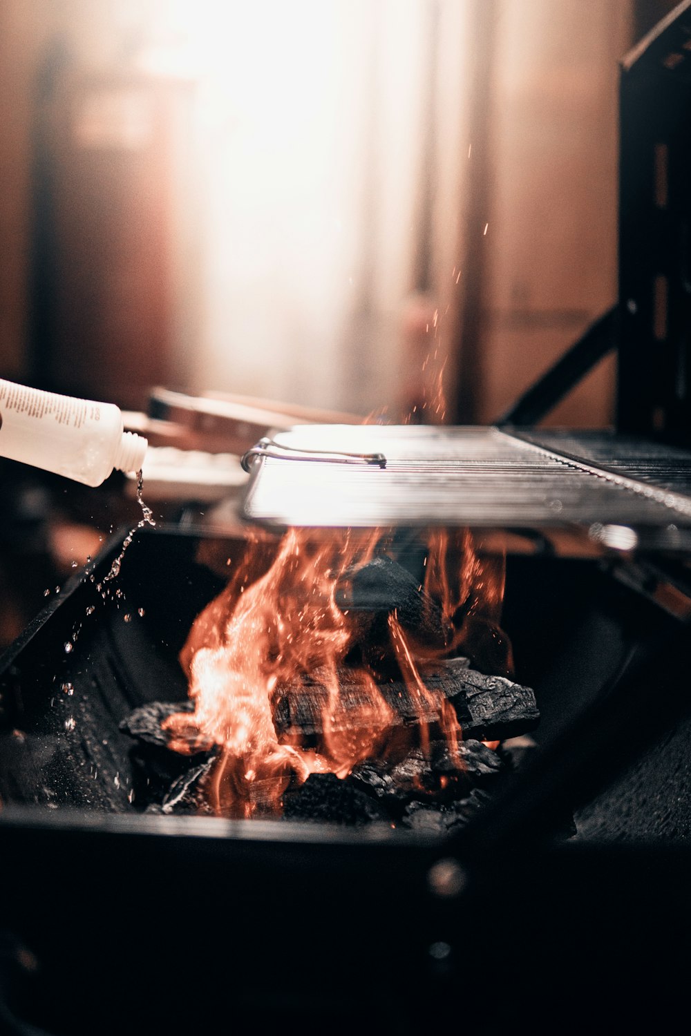 burning wood on black metal grill