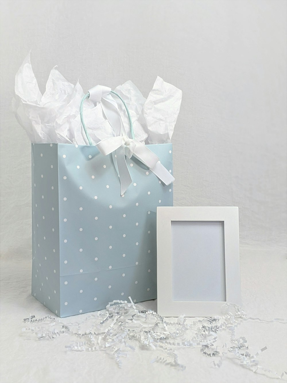 white and purple polka dot paper bag