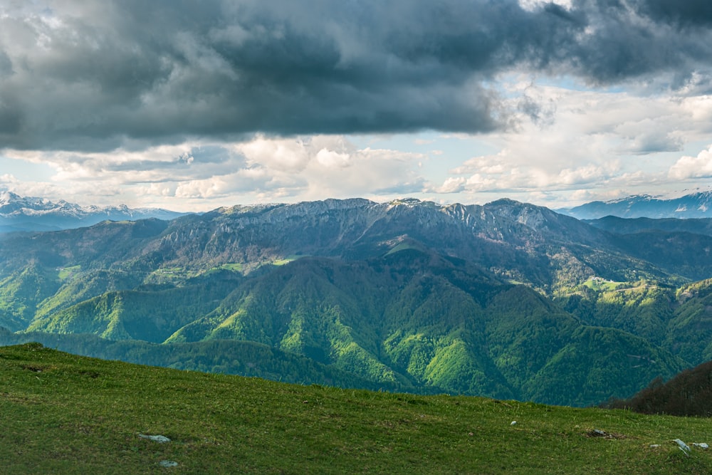 green mountains under white clouds during daytime