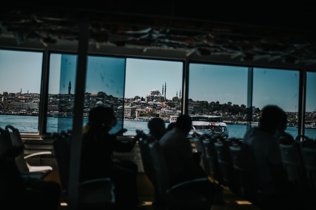 people sitting on chair near glass window during daytime