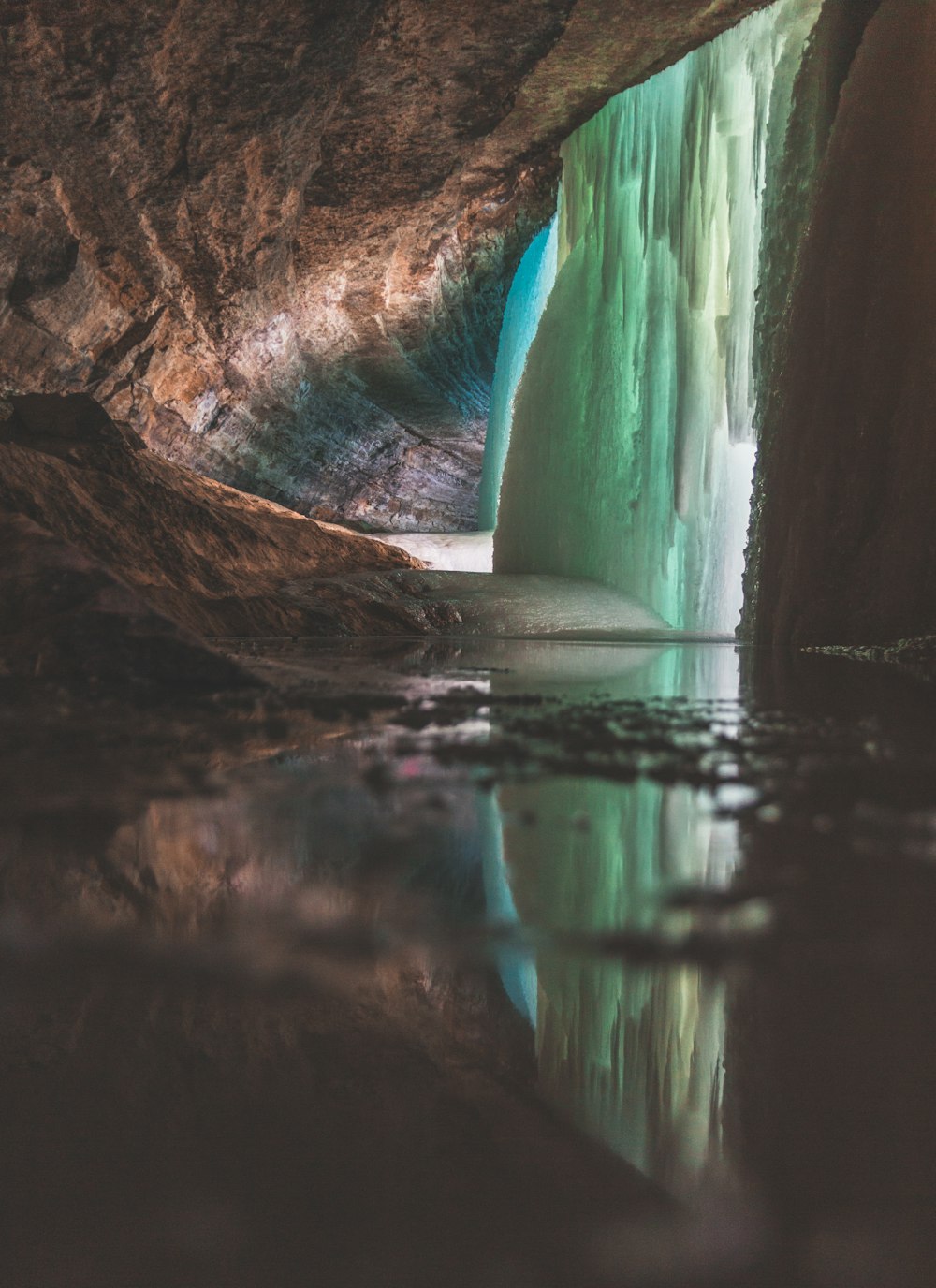 water falls on brown rock