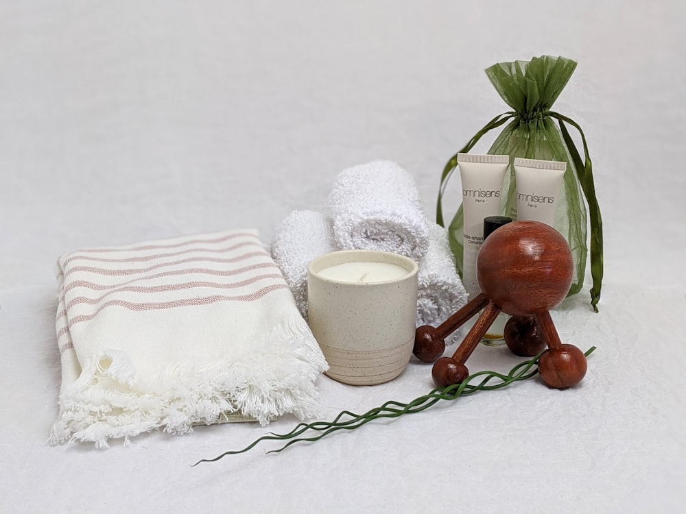 white ceramic mug beside brown wooden spoon