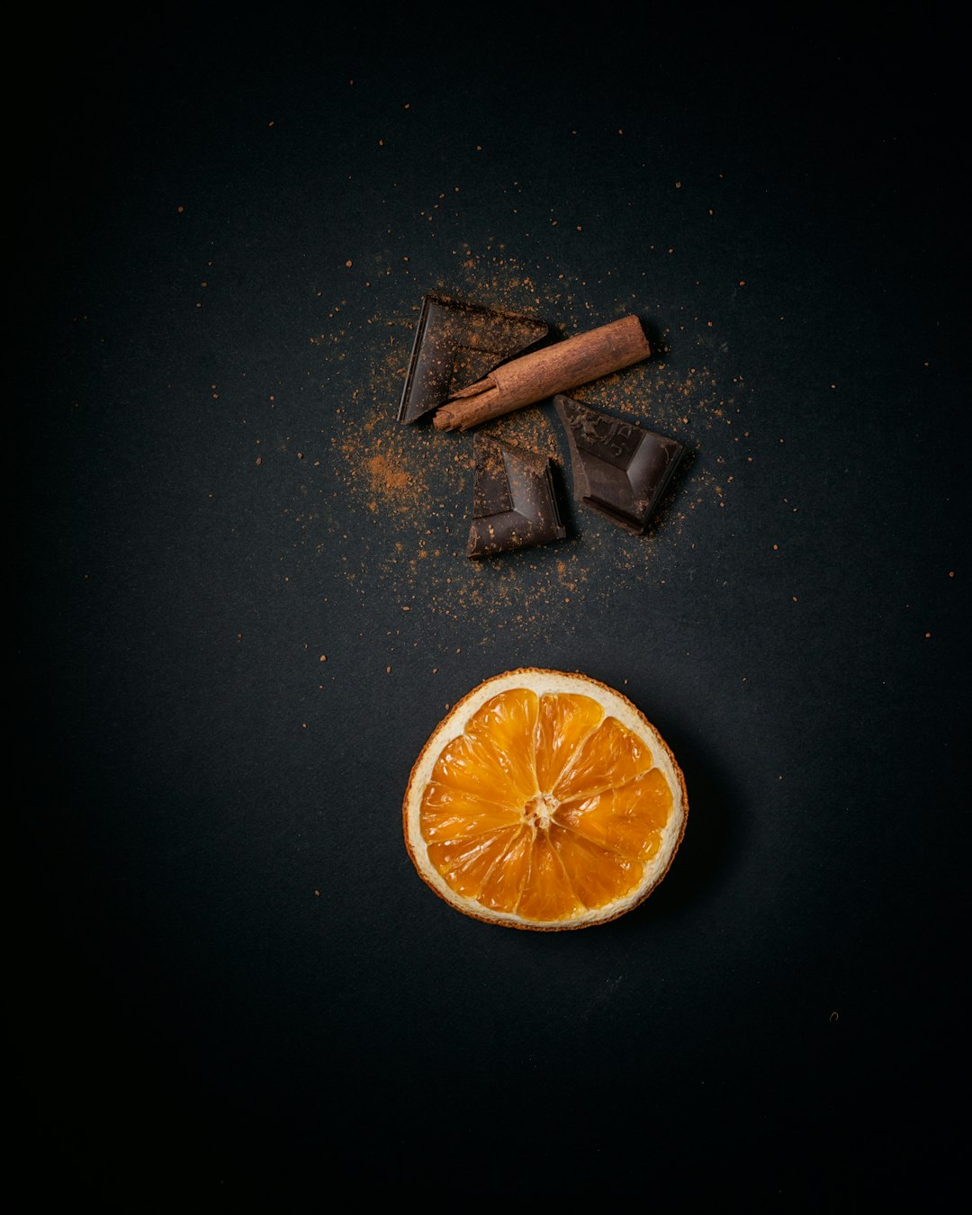 sliced orange fruit on black surface