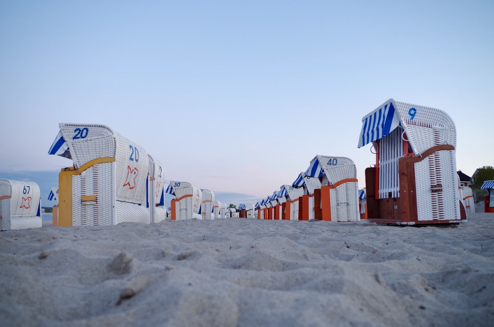 white and red houses on white sand during daytime