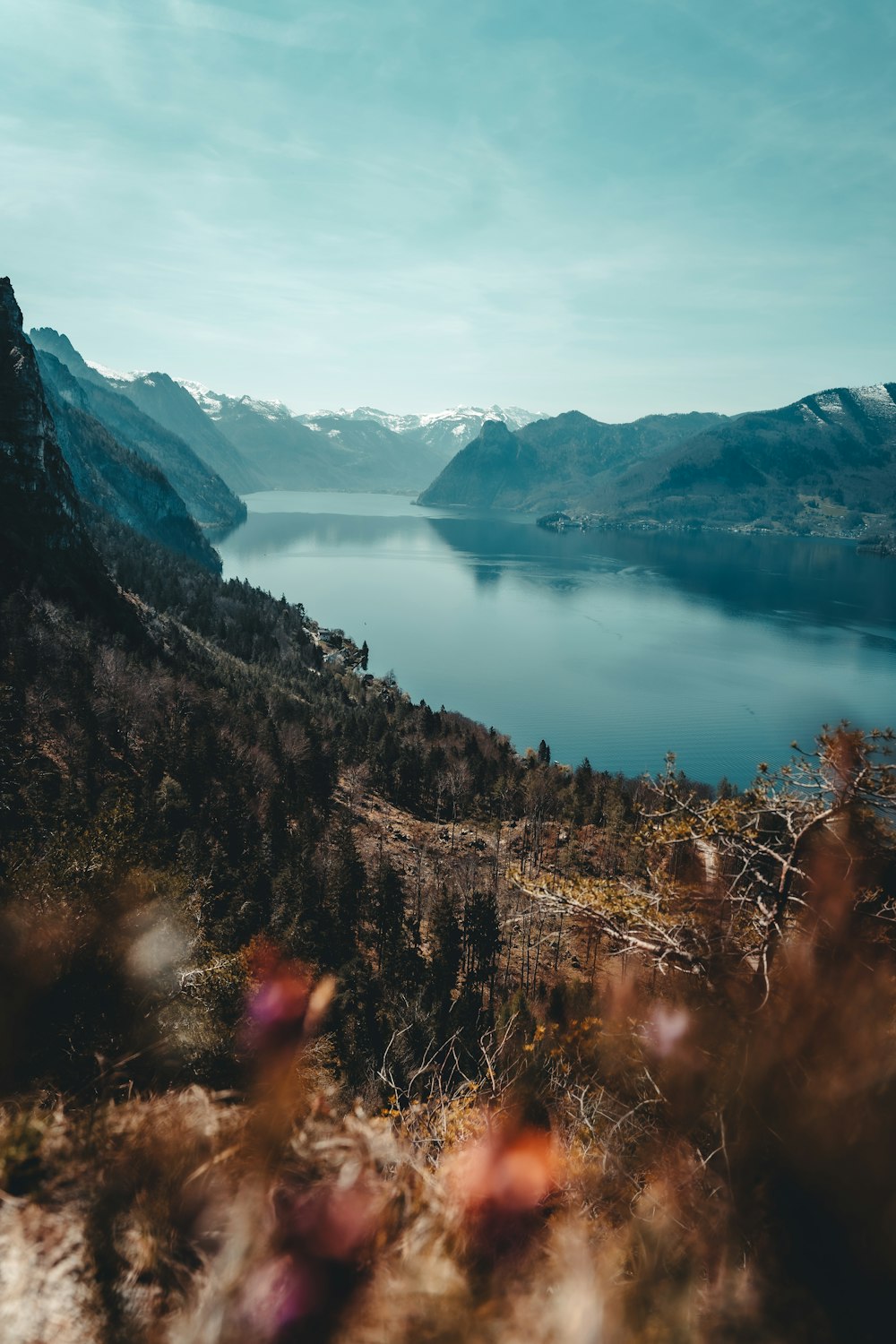 lake in the middle of mountains during daytime