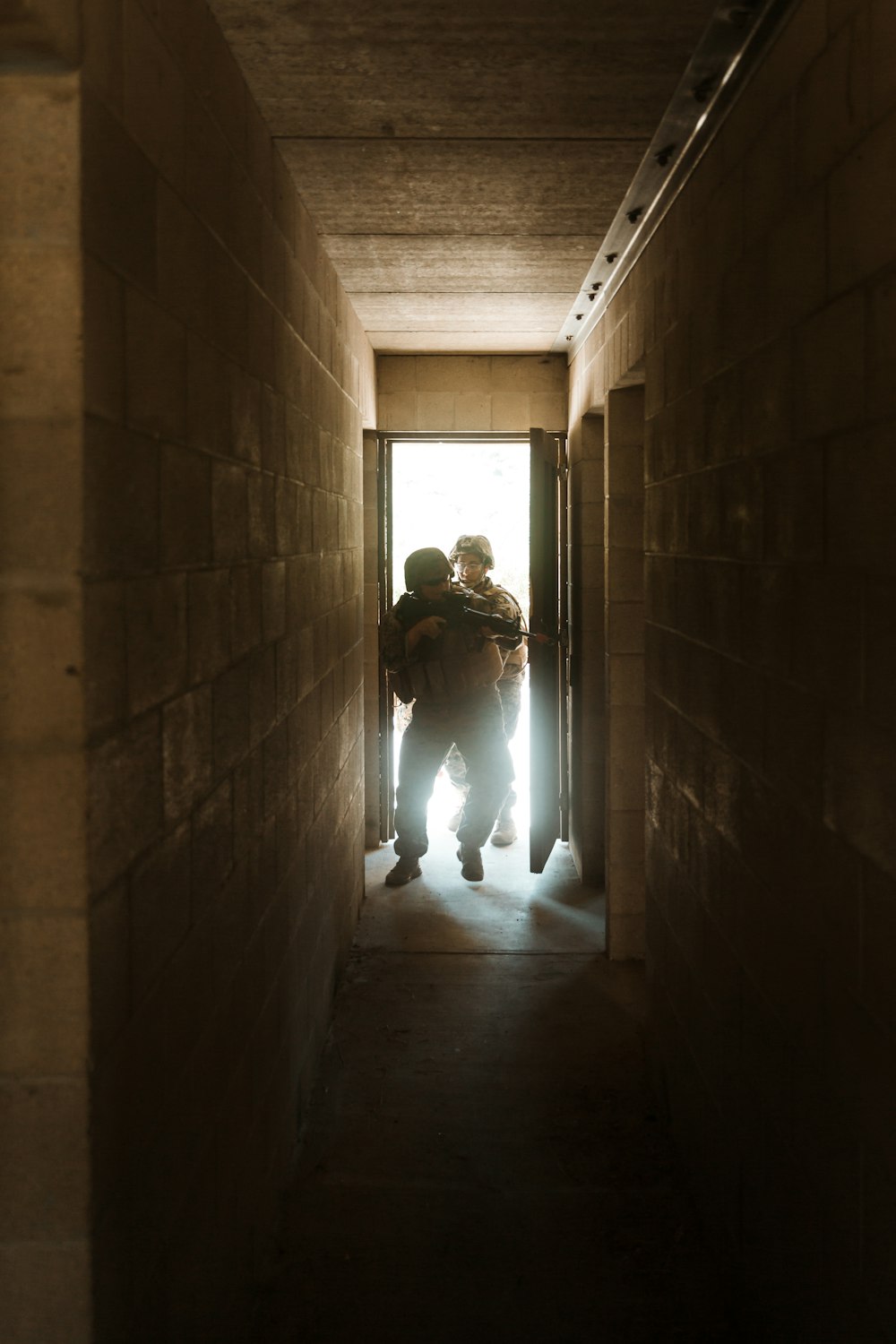 2 person walking on hallway