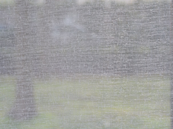 Close-up of the fine mesh fabric used in Ventiso’s pleated mosquito screens.