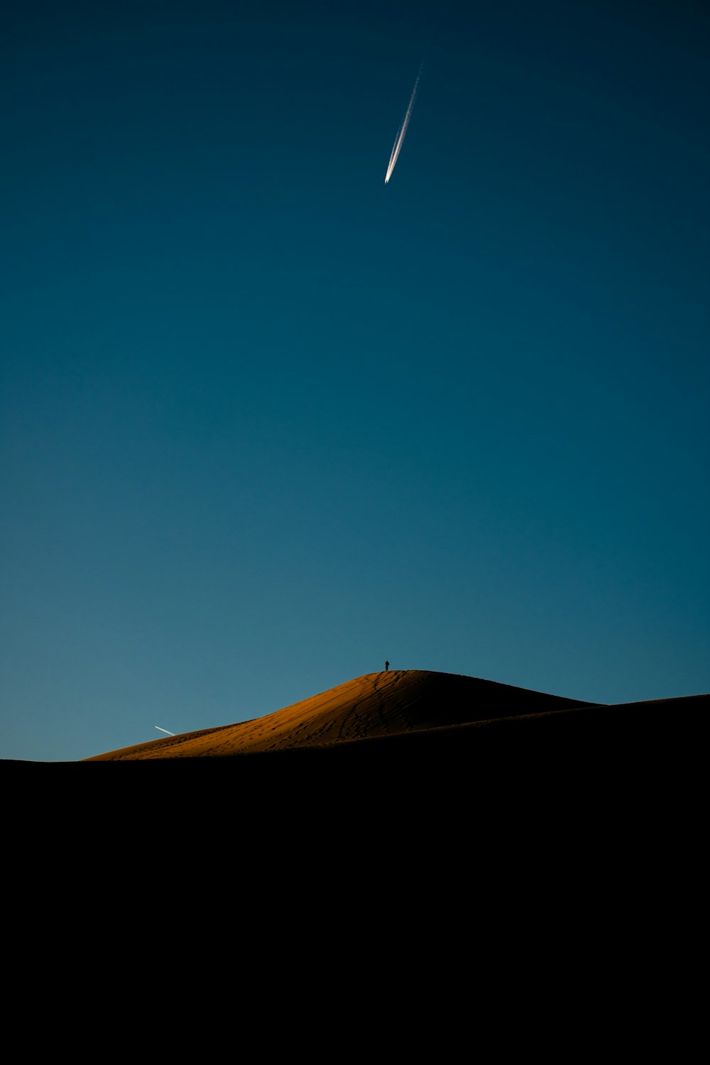 brown sand under blue sky during daytime