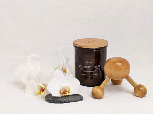 white and brown wooden spoon beside black ceramic mug