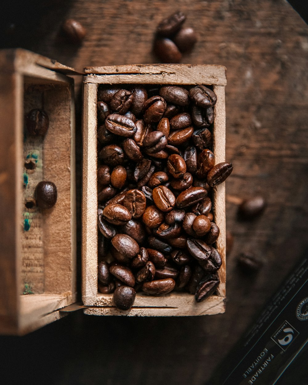 a wooden box filled with lots of coffee beans