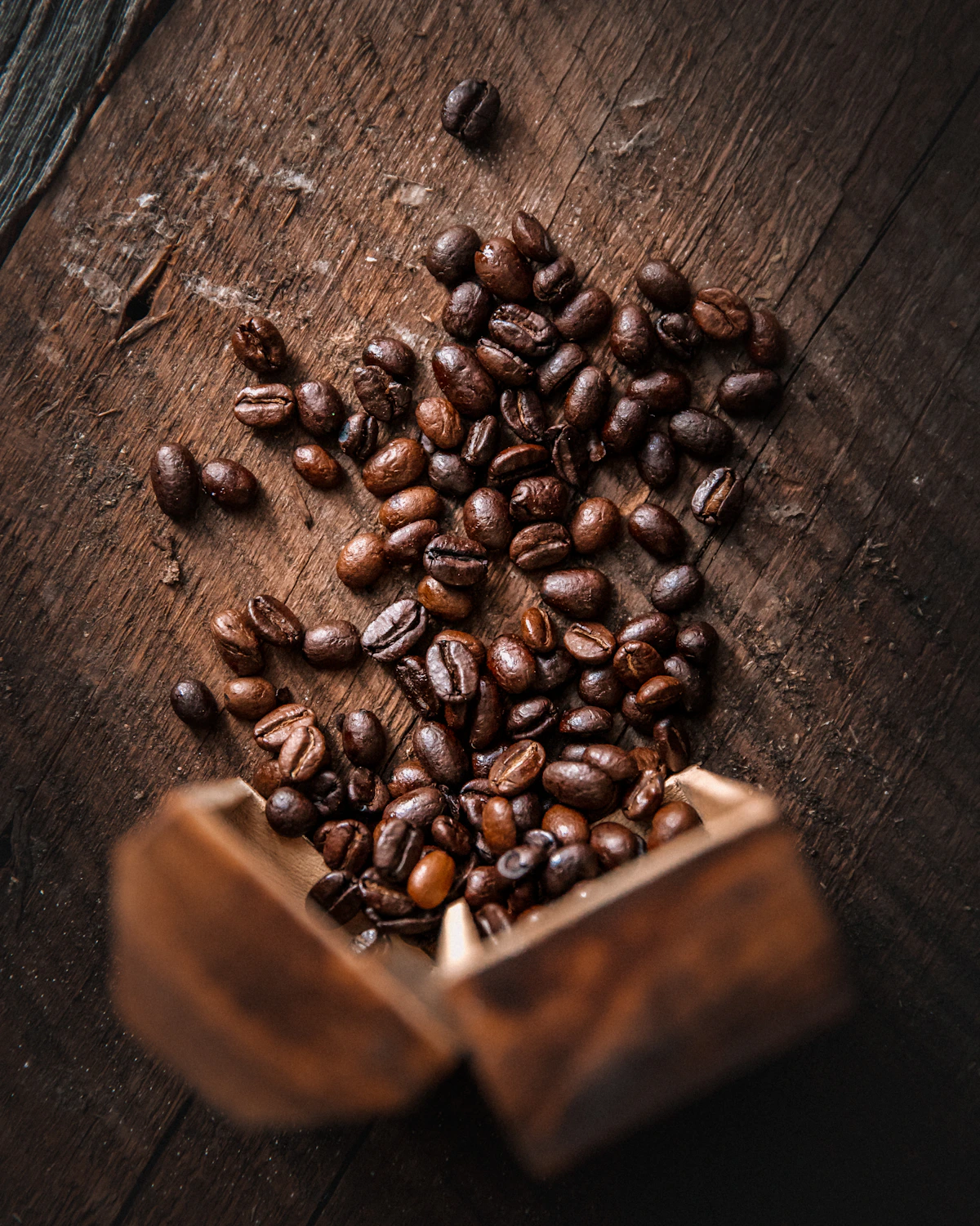 Roasted coffee beans on natural wood
