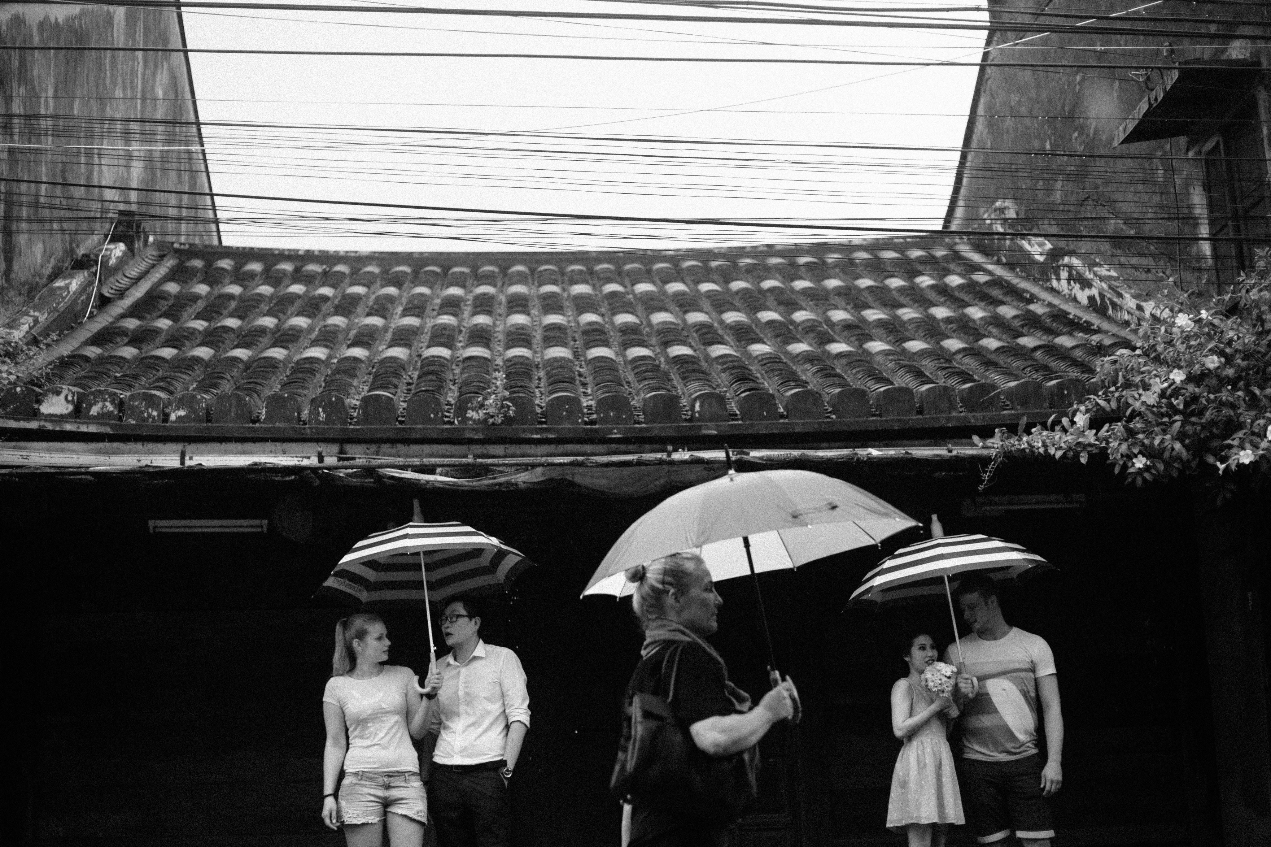 grayscale photo of people walking on street