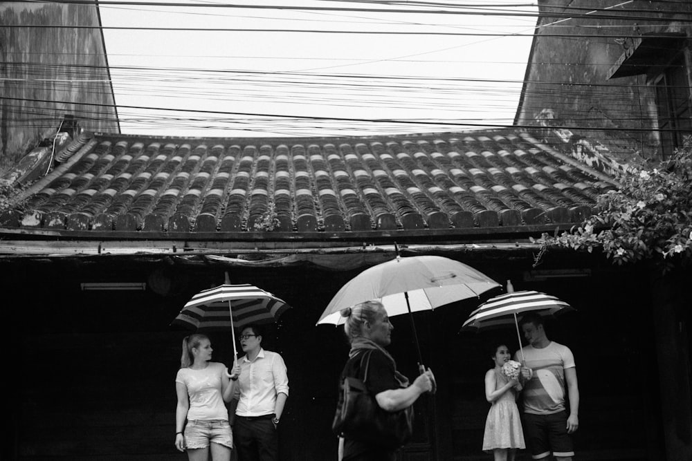 grayscale photo of people walking on street