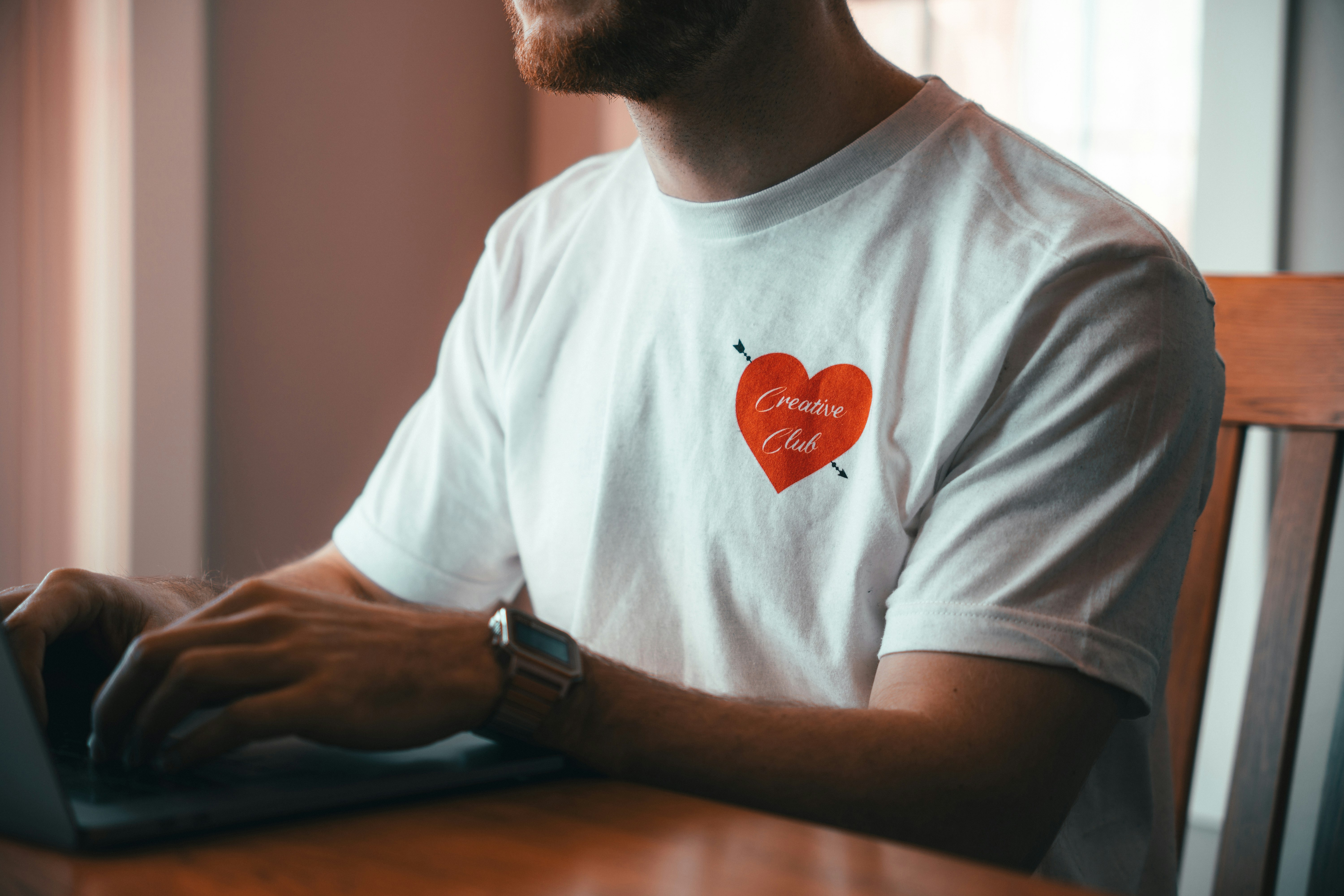 man in white crew neck t-shirt wearing black watch