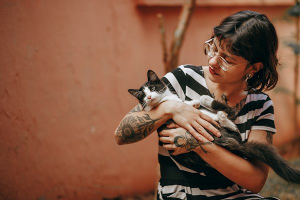 Person holding a cat