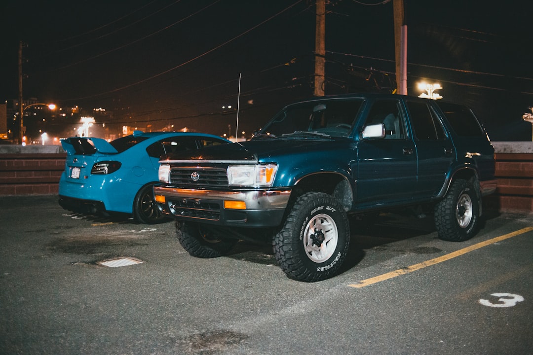 blue chevrolet crew cab pickup truck parked on parking lot during night time