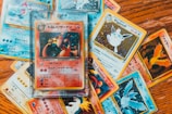 An array of pokemon trading cards fanned out on a table