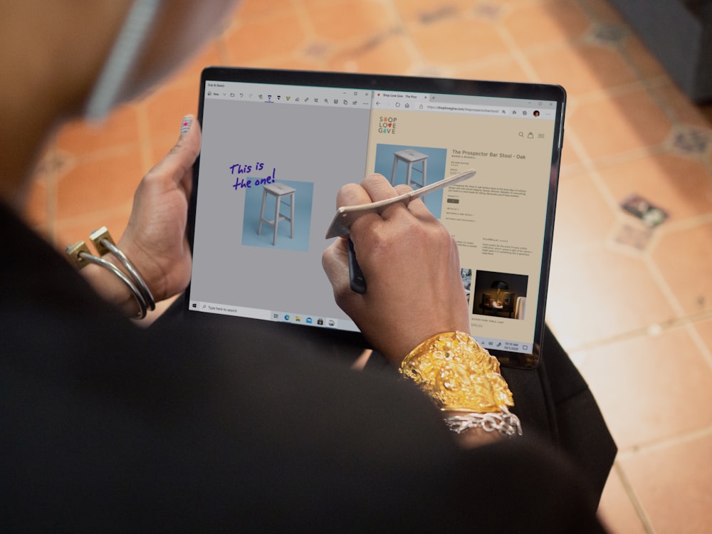 person using Surface computer on table