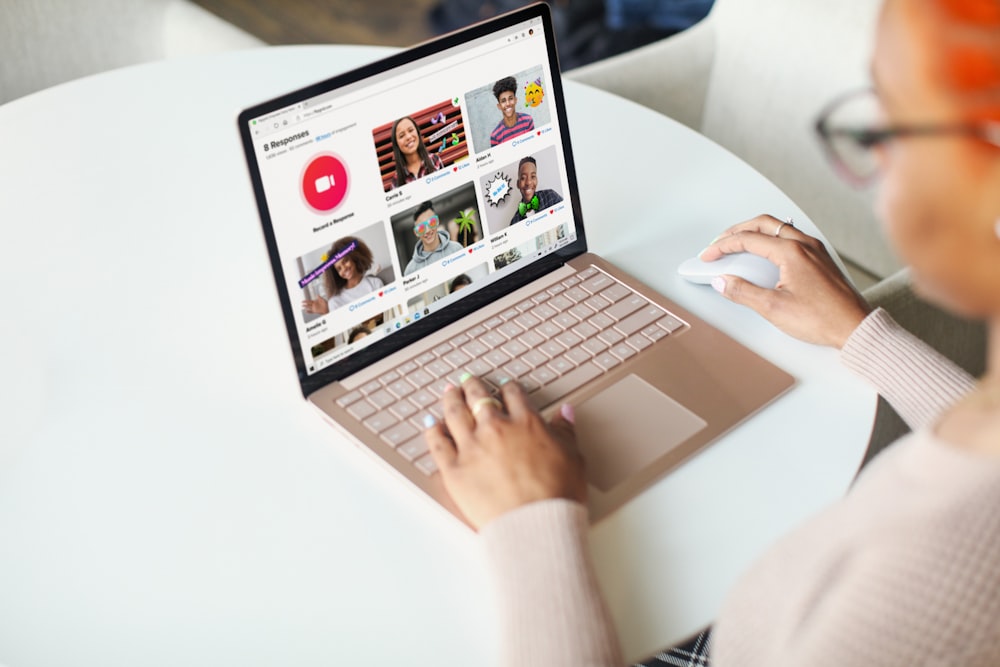 person using Surface device on white table