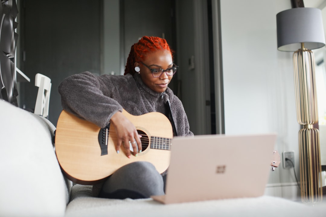 woman playing acoustic guitar