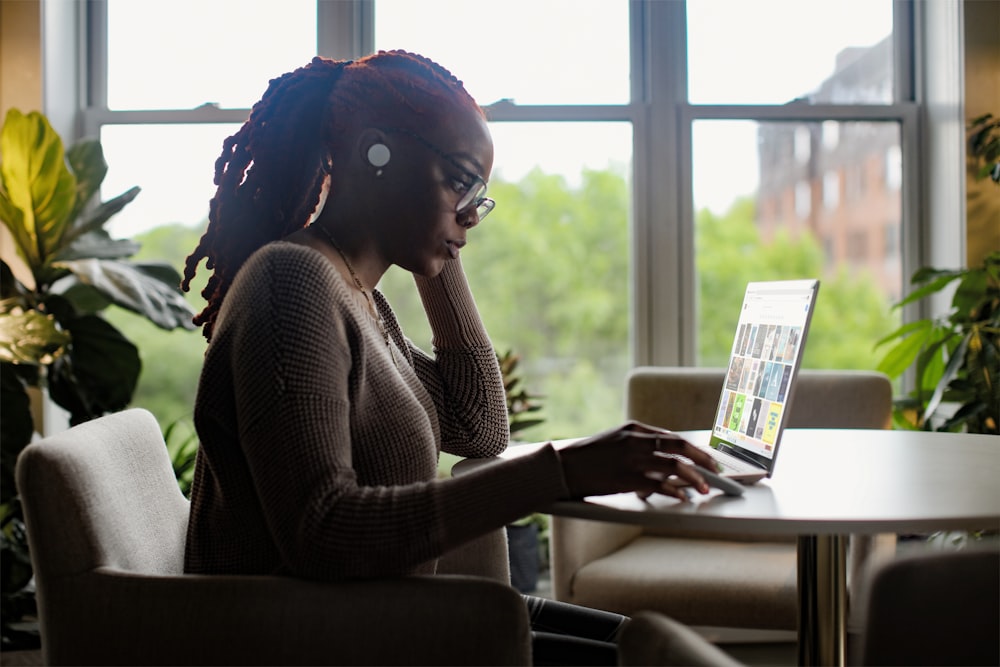 woman using Surface laptop