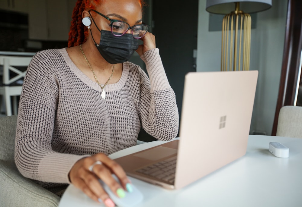 woman using Surface laptop