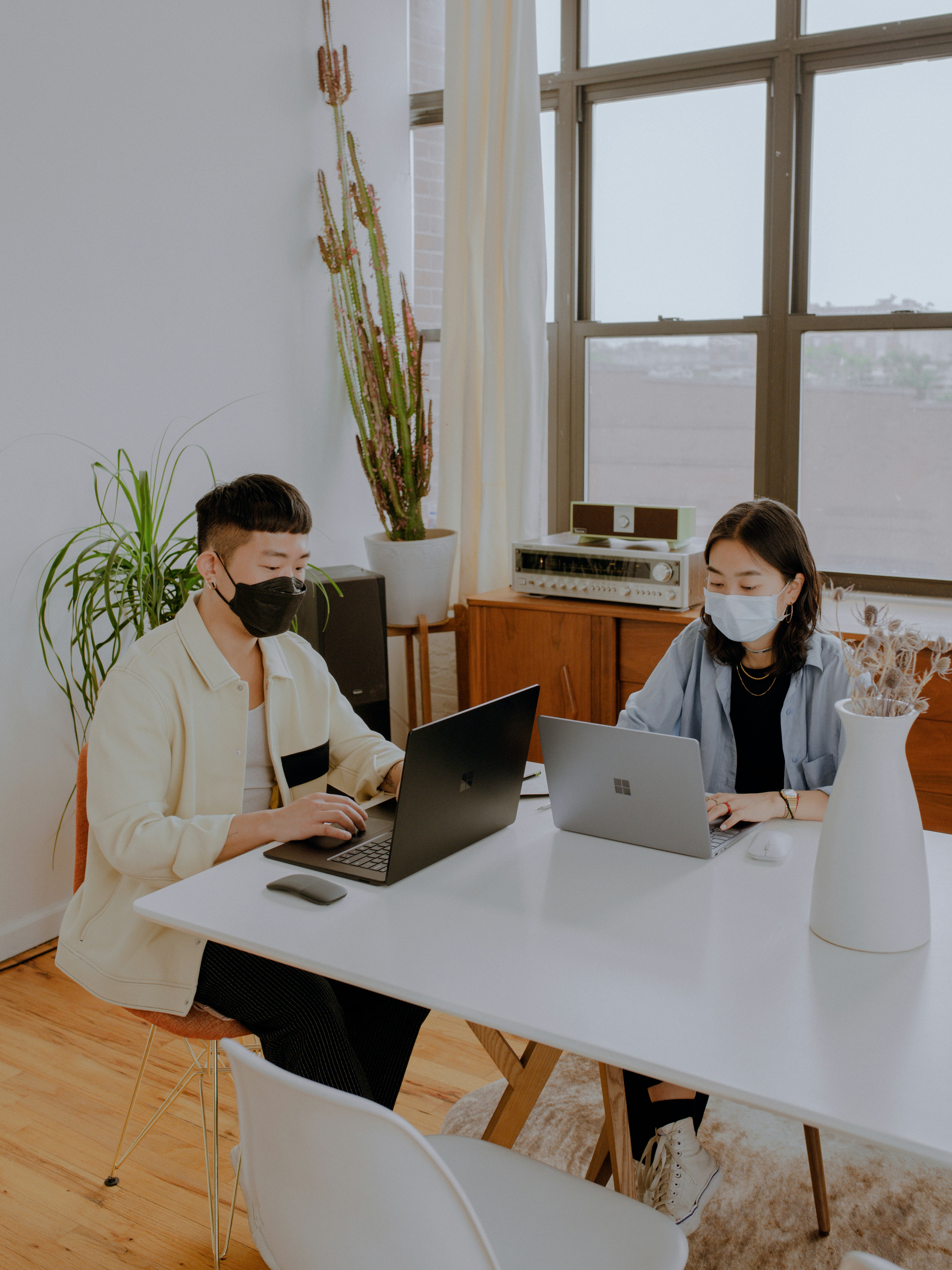 2 people sitting at table working photo – Free Image on Unsplash