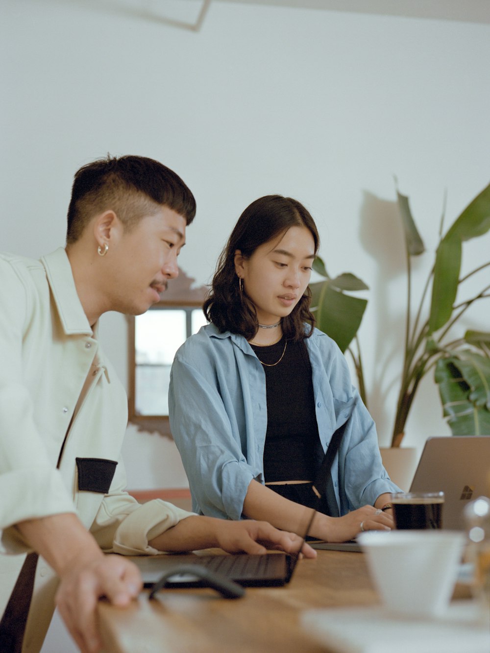 man and woman sitting at table