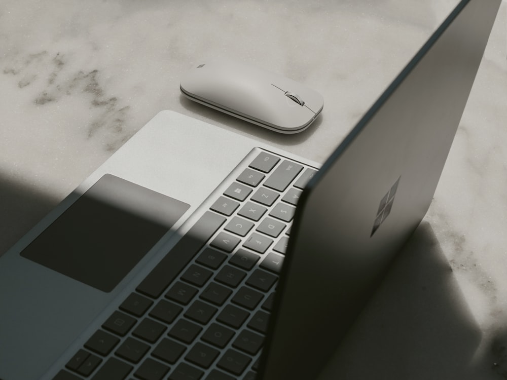 Surface laptop next to mouse
