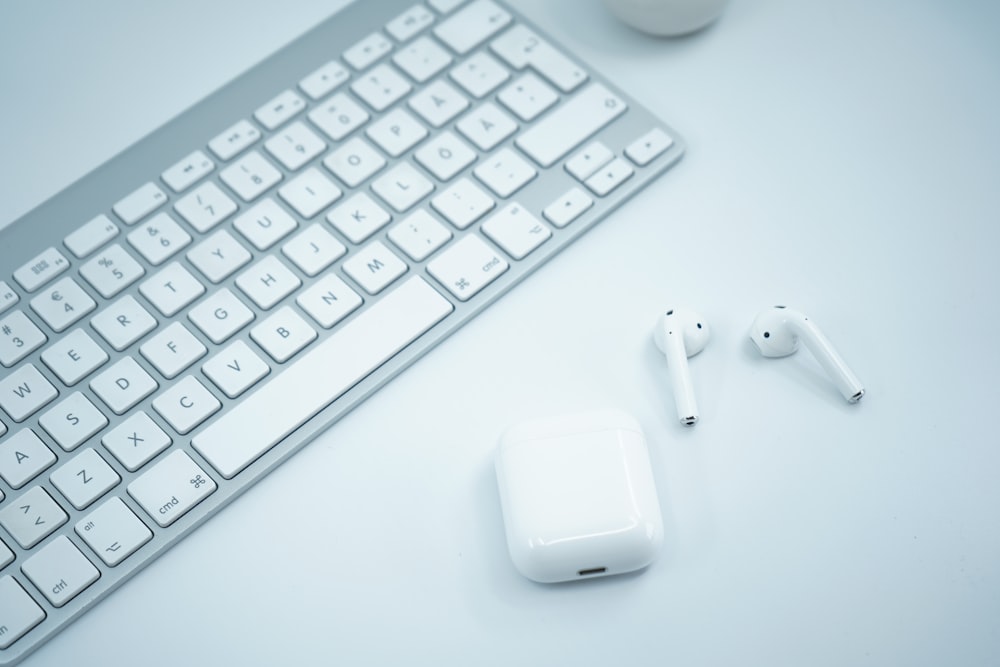 white apple keyboard and white apple magic mouse