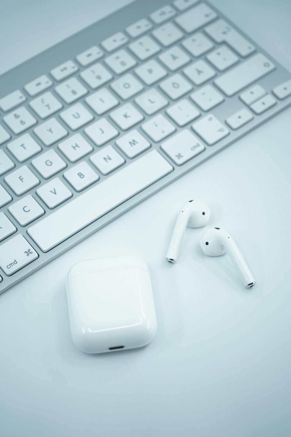 apple airpods on white surface