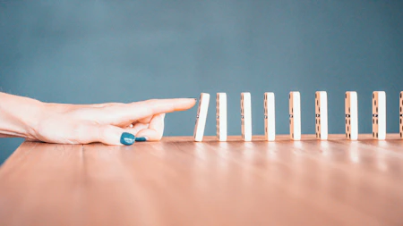 person holding white and blue plastic blocks