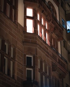 A view of architectural facade lighting on a building at night.