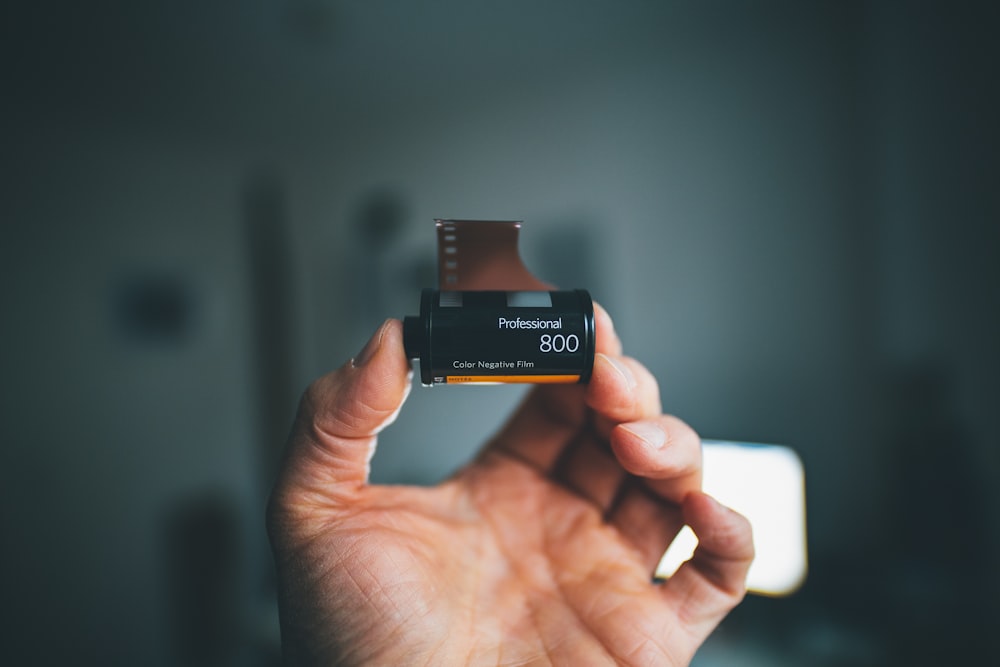 black and white box on persons hand