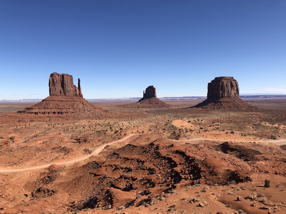 brown rock formation under blue sky during daytime