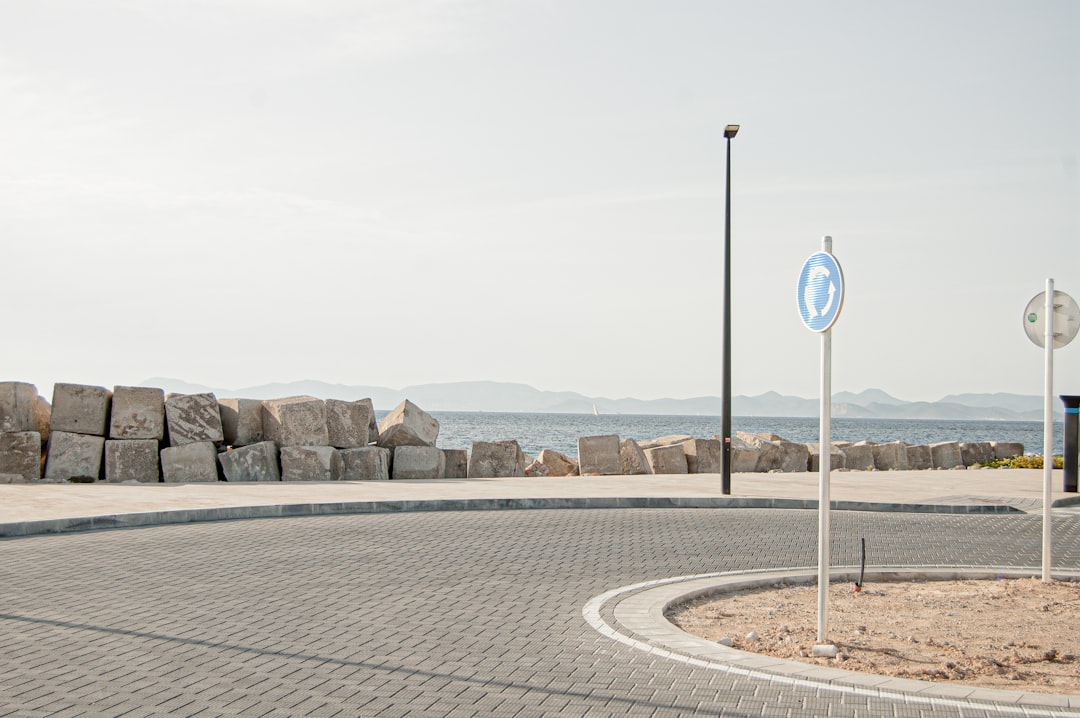 white and blue road sign