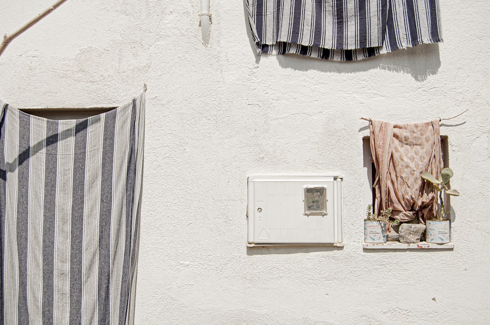 white thermostat mounted on white wall