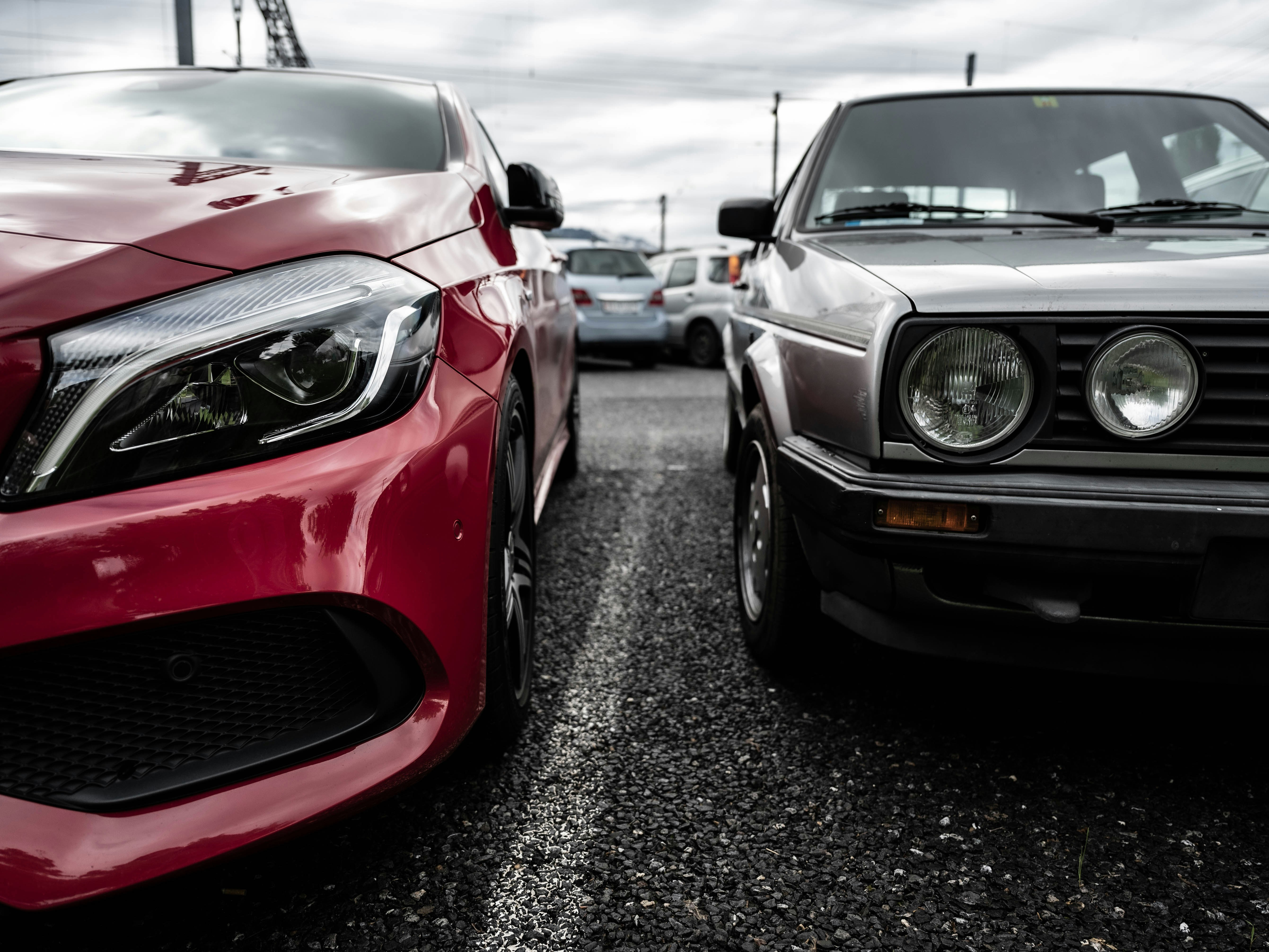 red bmw m 3 parked on parking lot during daytime