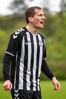 man in black and white adidas long sleeve shirt