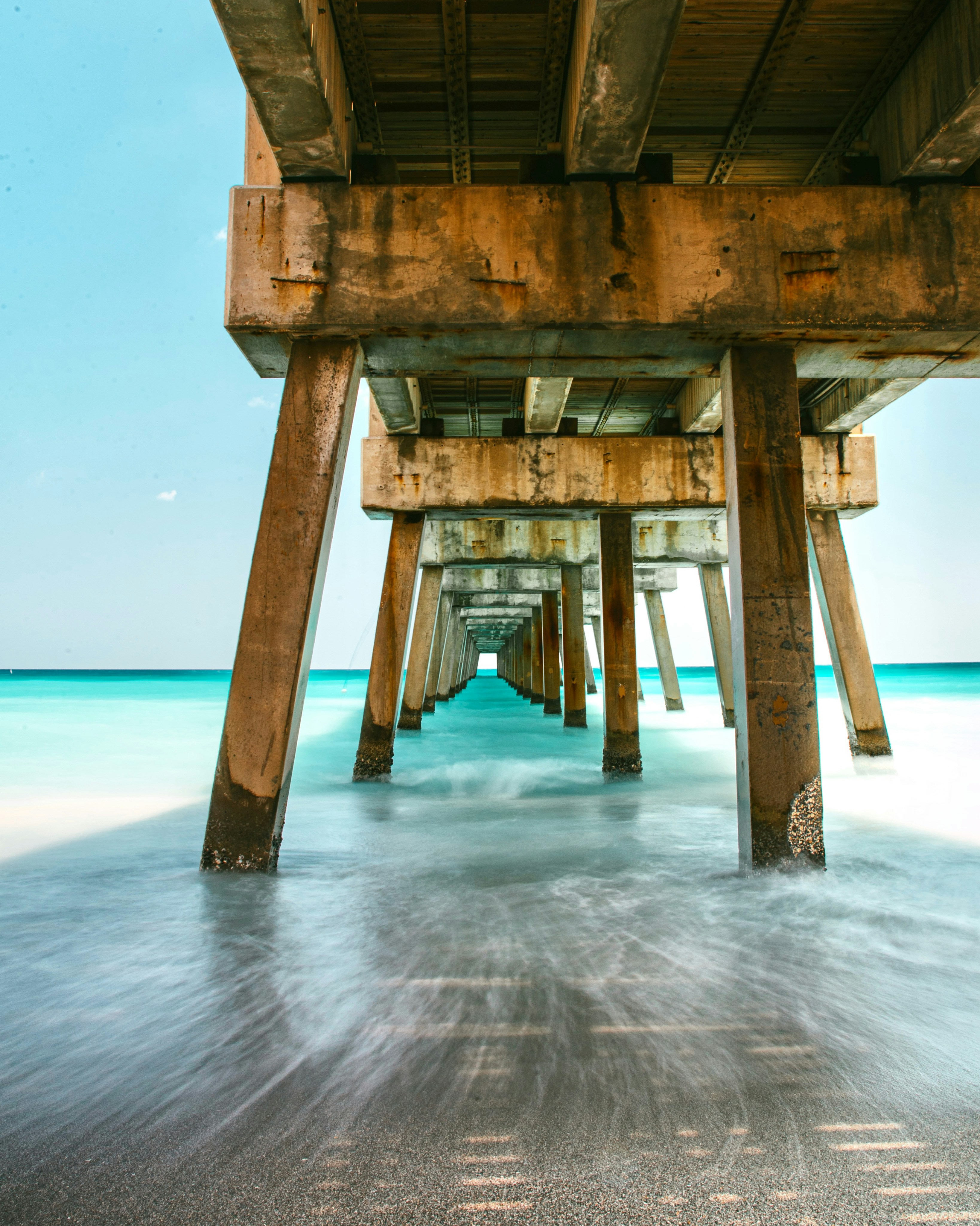 Brown wooden dock on blue sea under blue sky during daytime photo ...