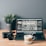 black laptop computer beside white ceramic mug on brown wooden table
