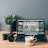 black laptop computer beside white ceramic mug on brown wooden table