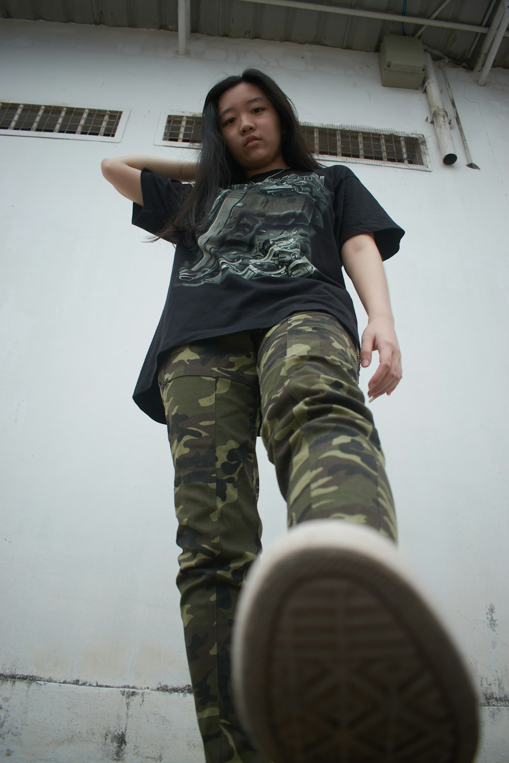 woman in black crew neck t-shirt and green camouflage pants