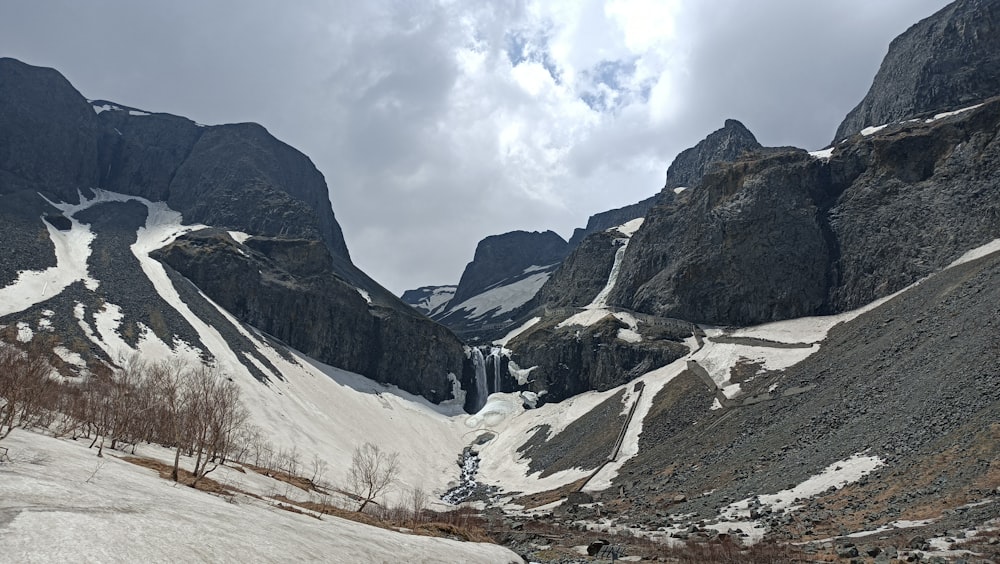 gray and white mountains under white clouds during daytime