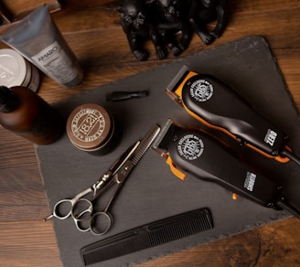 black and silver pocket knife beside silver round coins